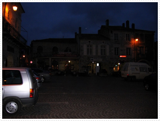 Center ville of Mezin, France - pizza parlor in background Center ville of Mezin, France - pizza parlor in background