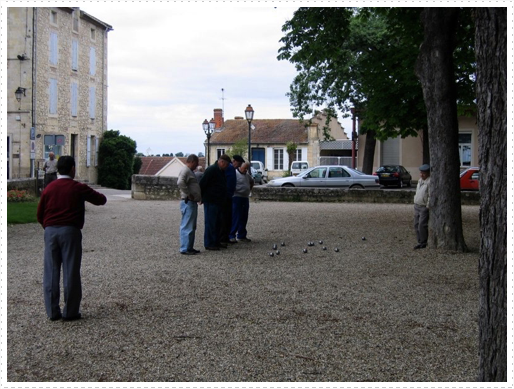 Locals playing bocce ball in park in Lectoure, France Locals playing bocce ball in park in Lectoure, France