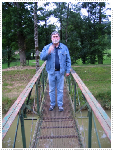 Mike on foot bridge by restaurant in Condom, France Mike on foot bridge by restaurant in Condom, France
