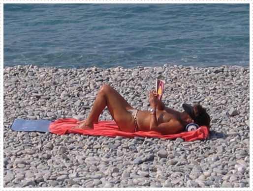 Female on rock beach in Nice, France Female on rock beach in Nice, France